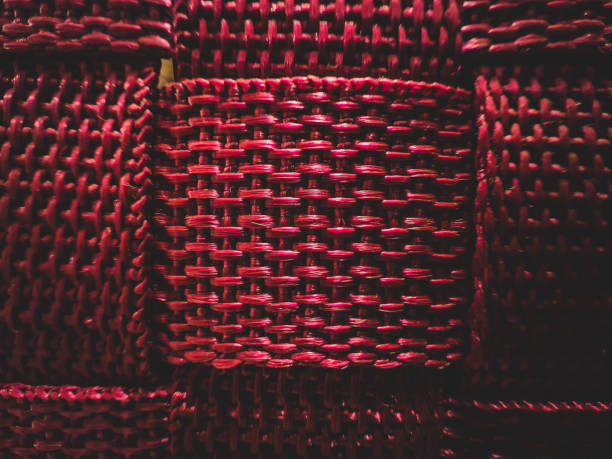 A braided, pink fabric as texture or background.