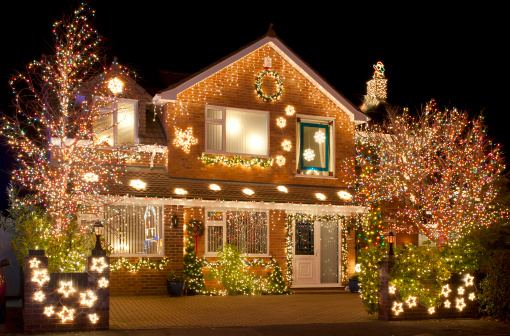 Christmas Lights outside on a house and in the garden