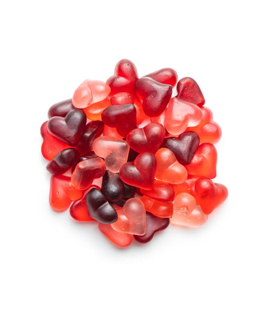 Heart shaped jelly candy isolated on white backgorund. Heart shaped jelly candy isolated on a white backgorund. red backgorund stock pictures, royalty-free photos & images