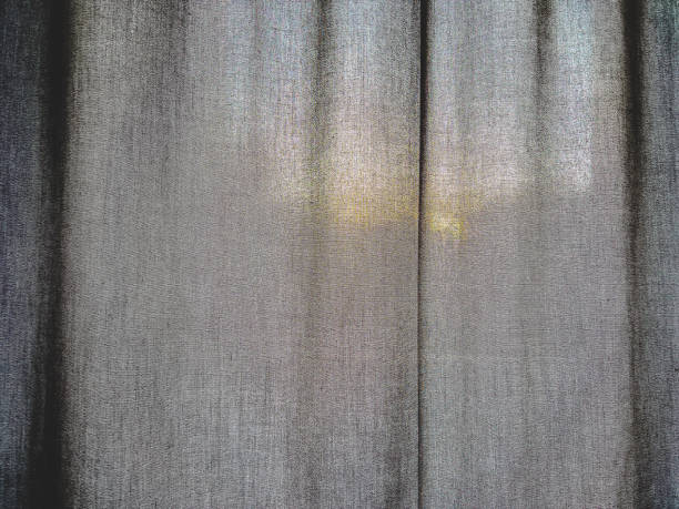 A dark fabric with the sun in the background.