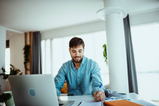 istock Man using laptop for business at home 1378077448