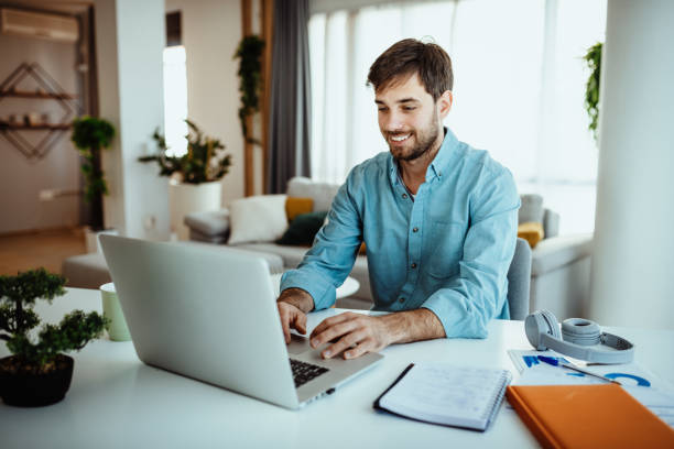 istock Man using laptop for business at home 1378077980