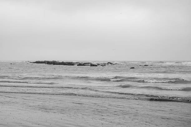 istock Waves and Rocks Seascape with Clouds 1378079190