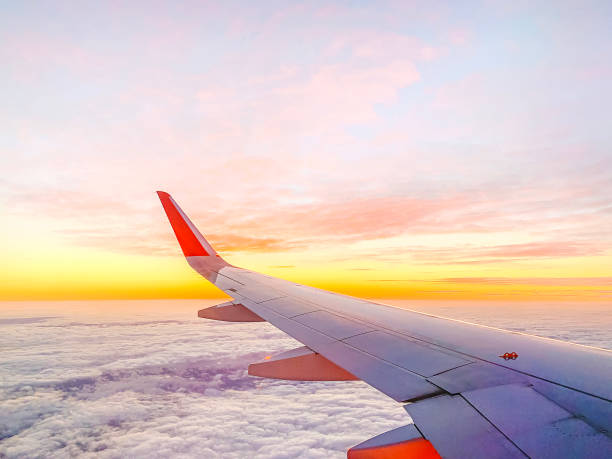 istock Airplane wing in the sky at beautiful sunse 1378081268