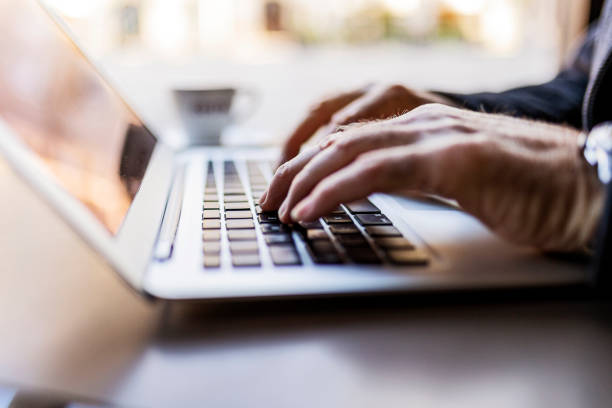 istock Hands of senior man using laptop 1378081965