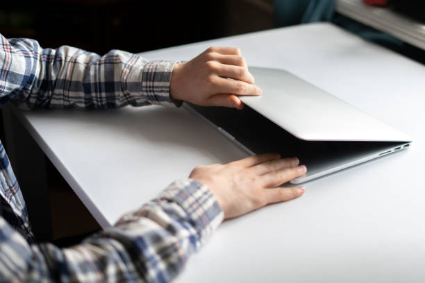 istock person opens laptop computer to do some online work on project 1378083954