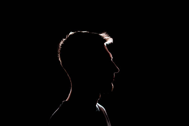 istock dark backlight shadow silhouette of male person, incognito unknown profile 1378085003