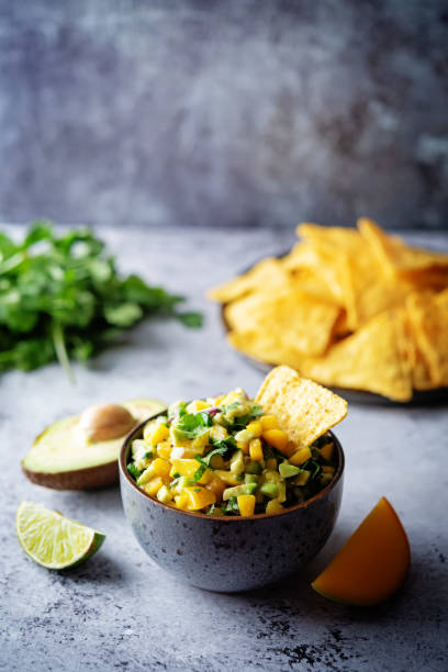 istock Mango Guacamole with corn chips and ingredients to prepare it 1378096192