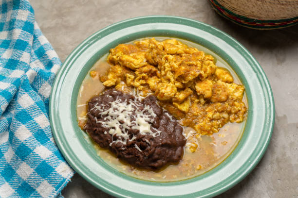 istock Scrambled eggs with red sauce and beans. Mexican food 1378098878