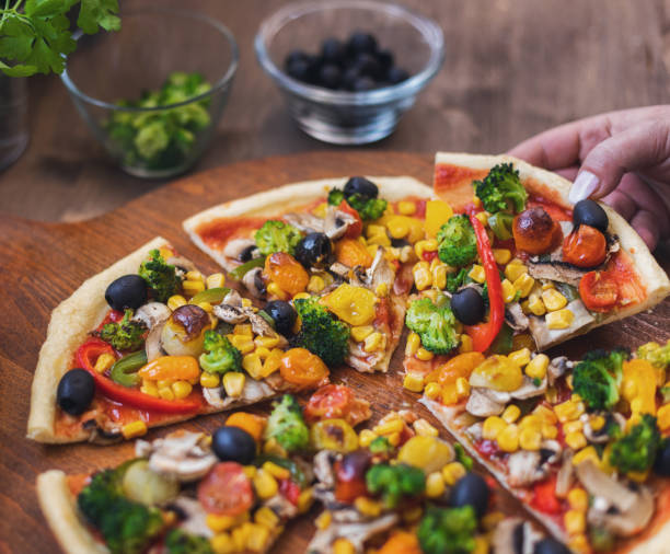 istock Vegetarian Pizza with Broccoli, Cherry Tomato, Pepper and Mushrooms 1378099178