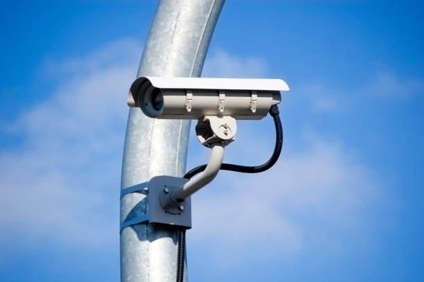 istock City monitoring system camera against blue sky. 1378103051