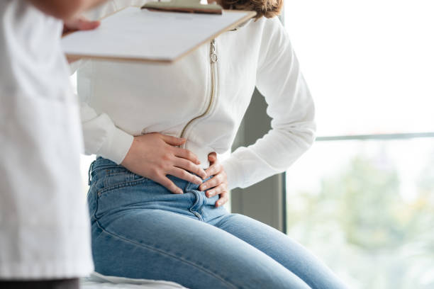 Young woman with stomach ache stock photo