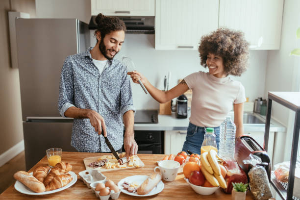 istock Family having fun in the kitchen while preparing breakfast 1378118405