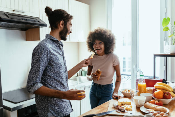 istock Romantic multiracial heterosexual couple in kitchen preparing food 1378118918