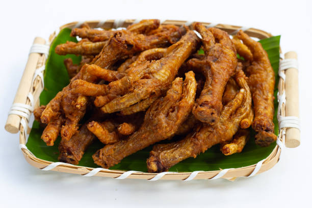 istock Fried chicken feet in bamboo basket on white background. 1378120464
