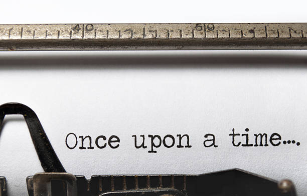 once upon a time - typewriter storytelling fairy tale book stock-fotos und bilder