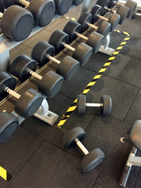 istock Dumbbells on the stand in gym 1378128271