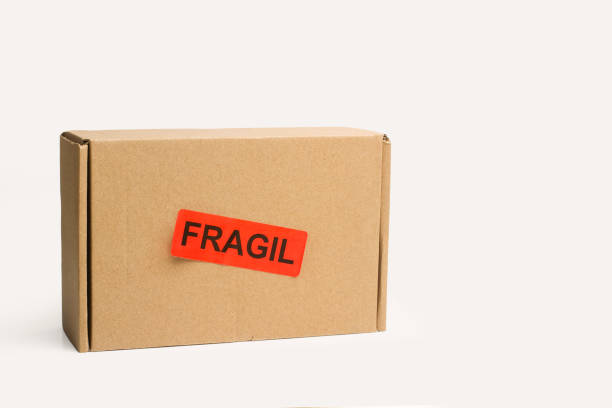 istock A cardboard box with a fragile stamp on a white background 1378136771