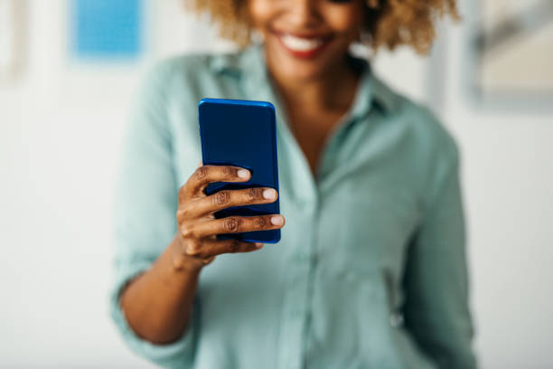 istock Anonymous Woman Holding a Smart Phone 1378158075