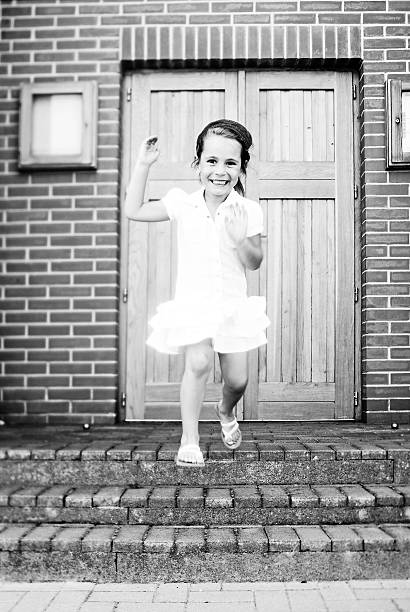 istock little girl jumping 137816401