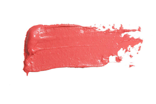 istock Smudged orange lipstick isolated on white background 1378171383