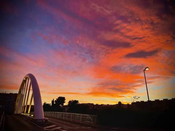 Modern bridge with vivid red Cloudy Sky.