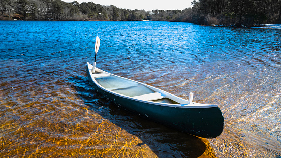 A canoe in the glacial pond on Cape Cod, USA