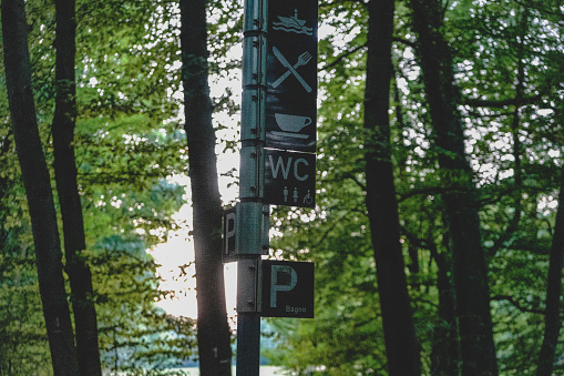 A directional sign on a lake for visitors.