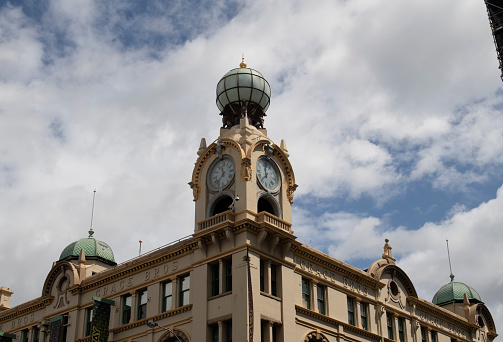 One of 2 clock towers with globe lamp on old Grace Brothers building on Broadway, Glebe, Sydney. Federation architecture. Restored and redeveloped to be part of Broadway Shopping Centre in 1992.