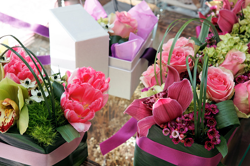 Mother's day concept. Pink gift box and tulips on pastel pink background. Copy space. High resolution 42Mp studio digital capture taken with Sony A7rII and Sony FE 90mm f2.8 macro G OSS lens