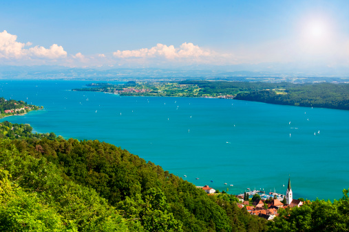 View on Lake Constance Bodensee with blue sky and the Alps in background