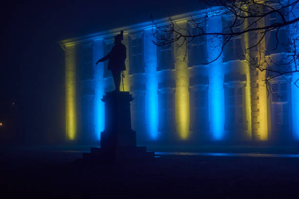Stuttgart, Germany – November 08, 2024: A long exposure of Stuttgart castle with the fountain in the foreground at night in Germany