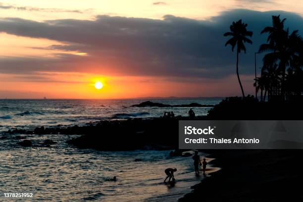 Dramatic Orange Sunset On Ondina Beach Stock Photo - Download Image Now - Backgrounds, Beach, Beauty
