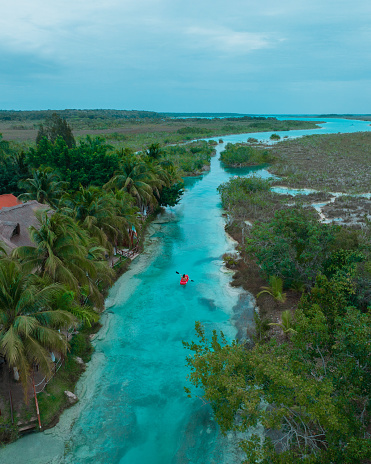 Scenic aerial  view of  red canoe on Bacalar Lagoon in Mexico