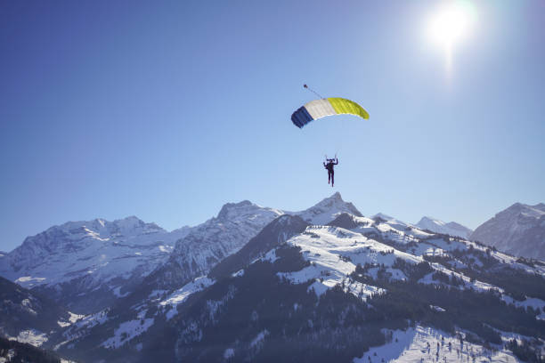 istock Female paraglider glides through clear skies 1378255081