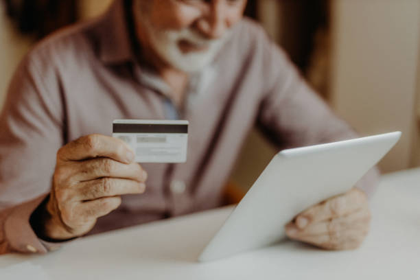 istock Senior man shopping online 1378258190