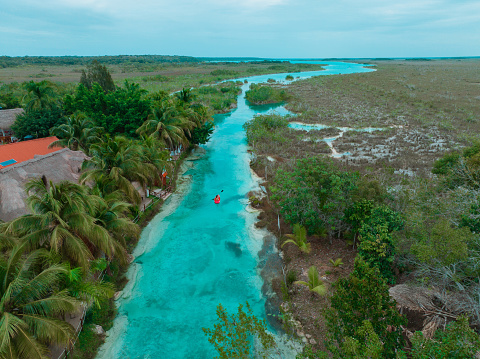 Scenic aerial  view of  red canoe on Bacalar Lagoon in Mexico