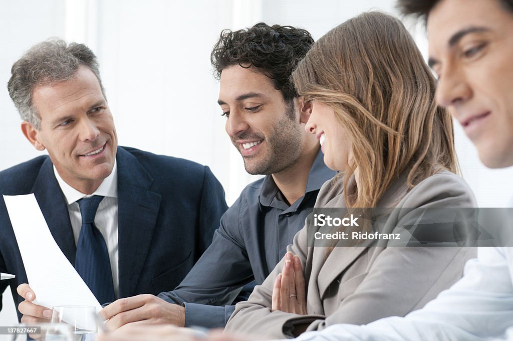 Teamwork at office Business people discussing and working together during a meeting in office. Adult Stock Photo