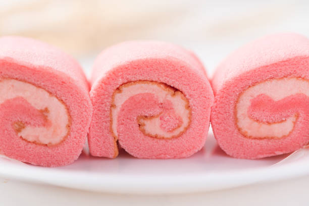 istock Pink strawberry roll cake or swiss roll with whipped cream 1378324294