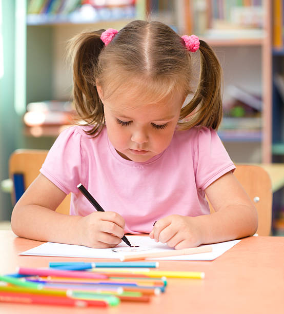 istock Little girl is drawing with felt-tip pen 137832731
