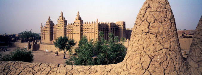 The great mud Mosque at Djenne (near Timbuktu) in West Africa framed by the features of another adobe (mud) building.
