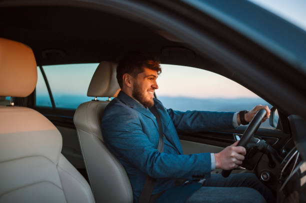 istock Smiling businessman on a work trip on sunset. 1378379906