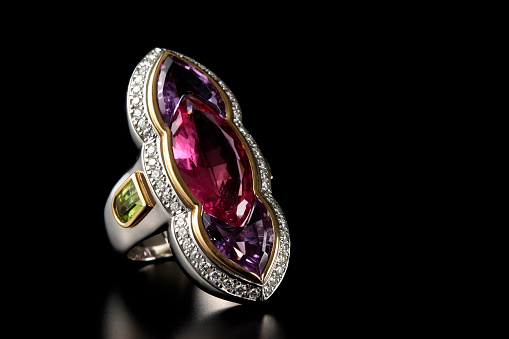 Luxury ruby diamond ring on black background with copy space.