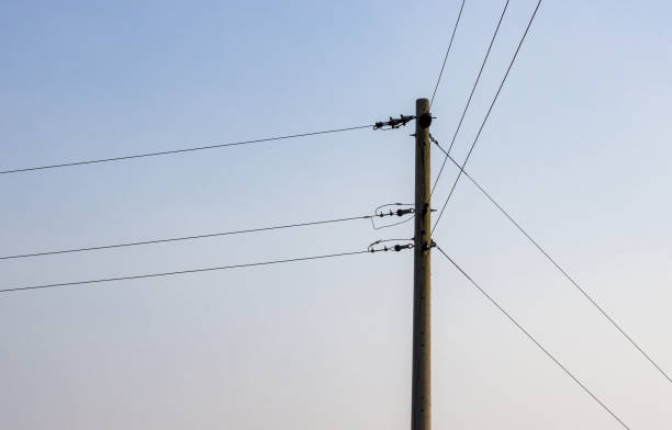 istock Single electricity transmission pole under the evening sky with copy space 1378389932