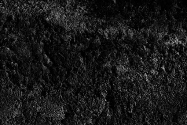 istock Old abandoned rough textured dark cement plaster wall surface for background 1378390965