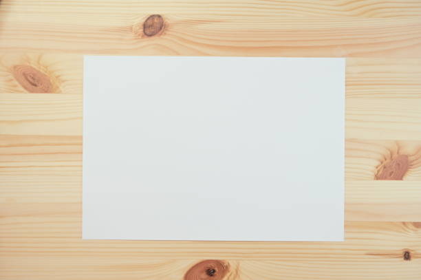istock white paper on wood table 1378395780