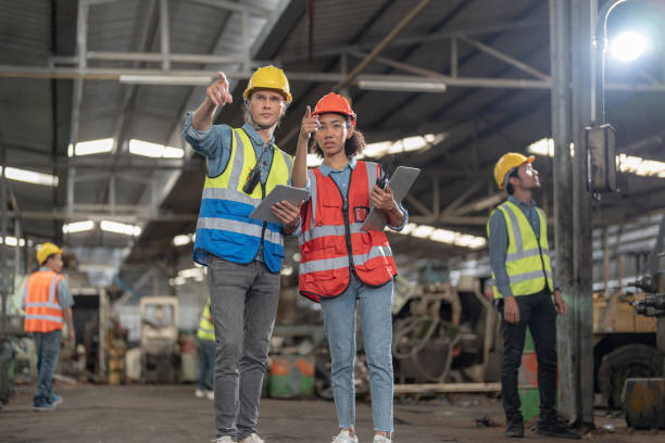 istock Professional engineering workers walk and check in warehouse factory. Manager discuss inspection report for internal audit. Quality assurance for manufacturing. Concept Engineer Operating. 1378402145