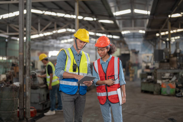 istock Professional engineering workers walk and check in warehouse factory. Manager discuss inspection report for internal audit. Quality assurance for manufacturing. Concept Engineer Operating. 1378403219