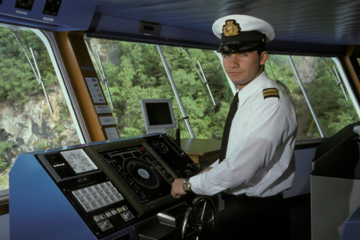 Ship's officer at the helm of a ship