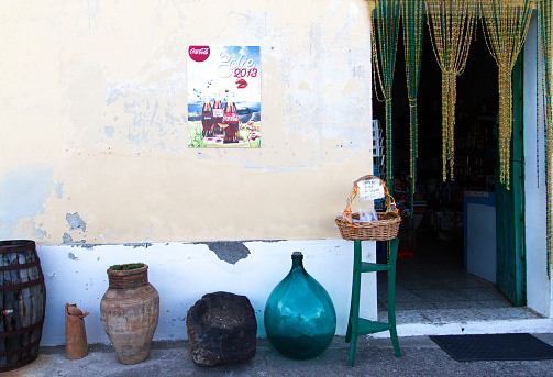 Salina, Aeolian Islands, Sicily: A doorway to a small market with beaded curtains and pots out front in Lingua, a village in southern Salina.